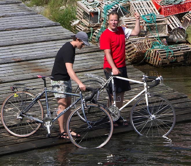 Greg and his son on a bike